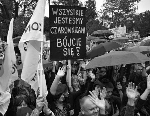 Figure 4. Polish protesters with poster stating "Wszyscy jesteśmy czarownicami, bójcie się!" (we are all witches, fear us!). 